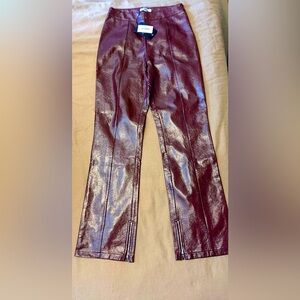 Burgundy faux leather pants with zippers